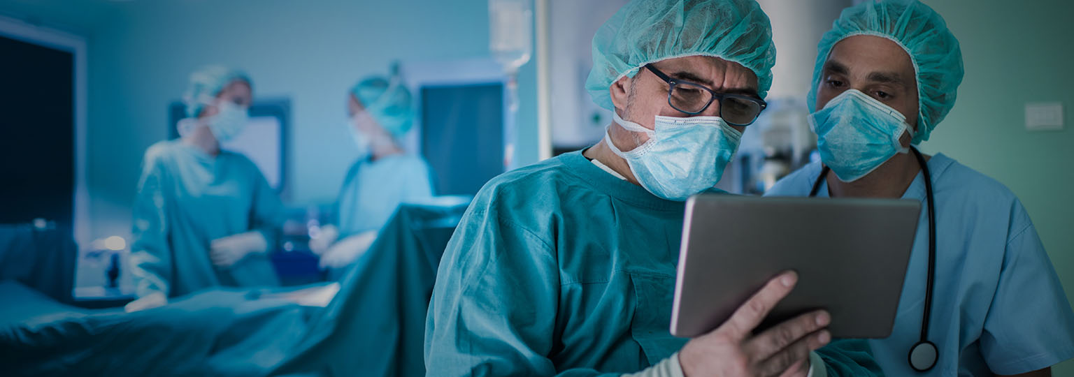 doctors reviewing reports on ipad