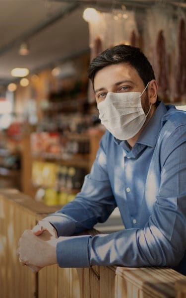 man in restaurant with mask